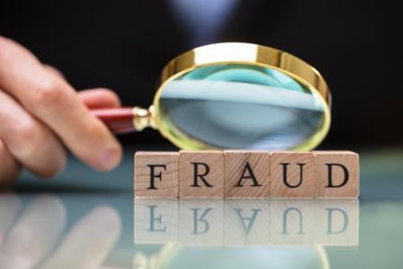fraud-magnifying-glass-compressed.jpeg
